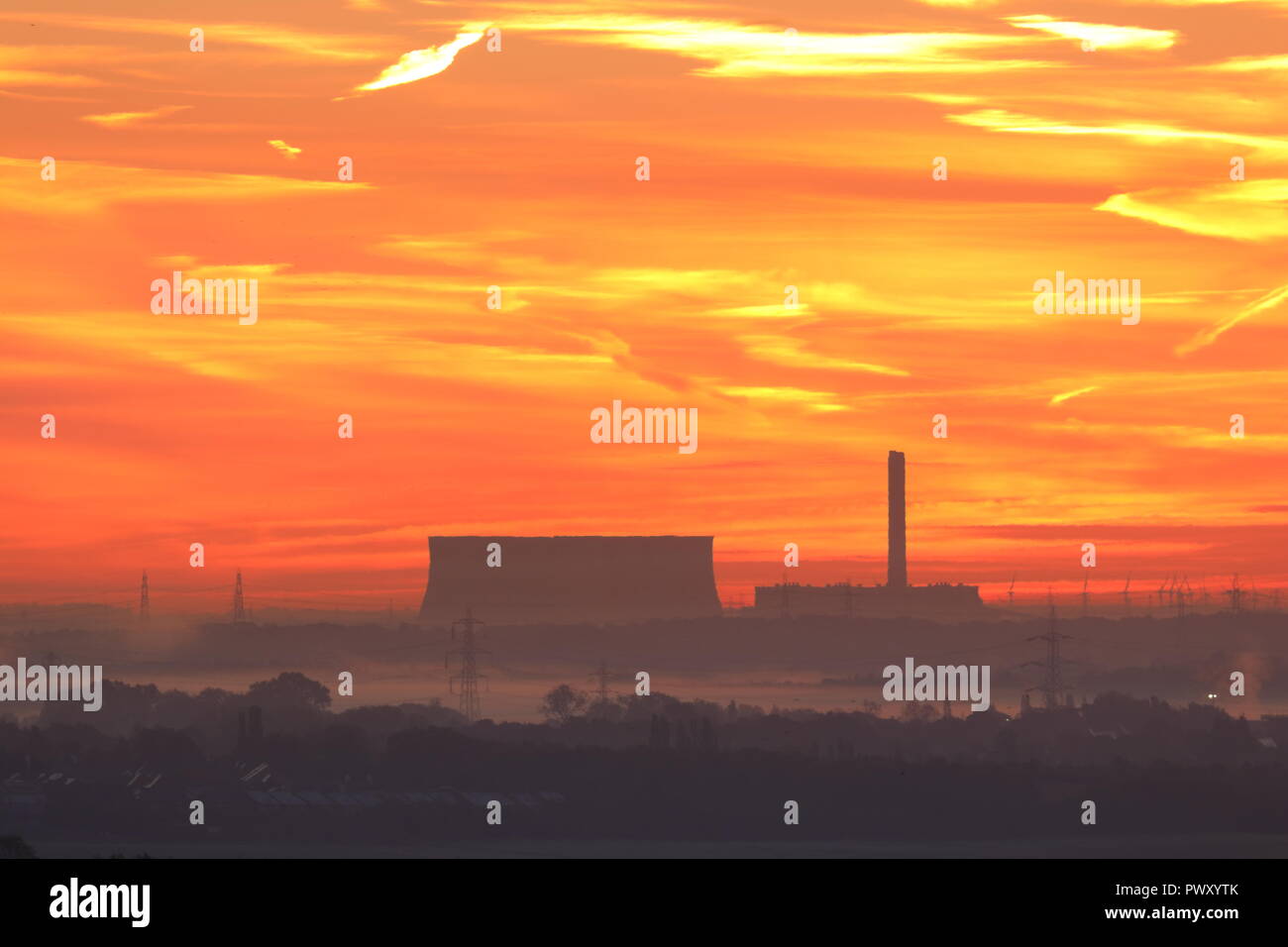 Eggborough Power Station, Leeds. 18th Oct 2018. UK Weather: Sunrise over Eggborough Power Station from Rothwell Country Park in Leeds Credit: Yorkshire Pics/Alamy Live News Stock Photo