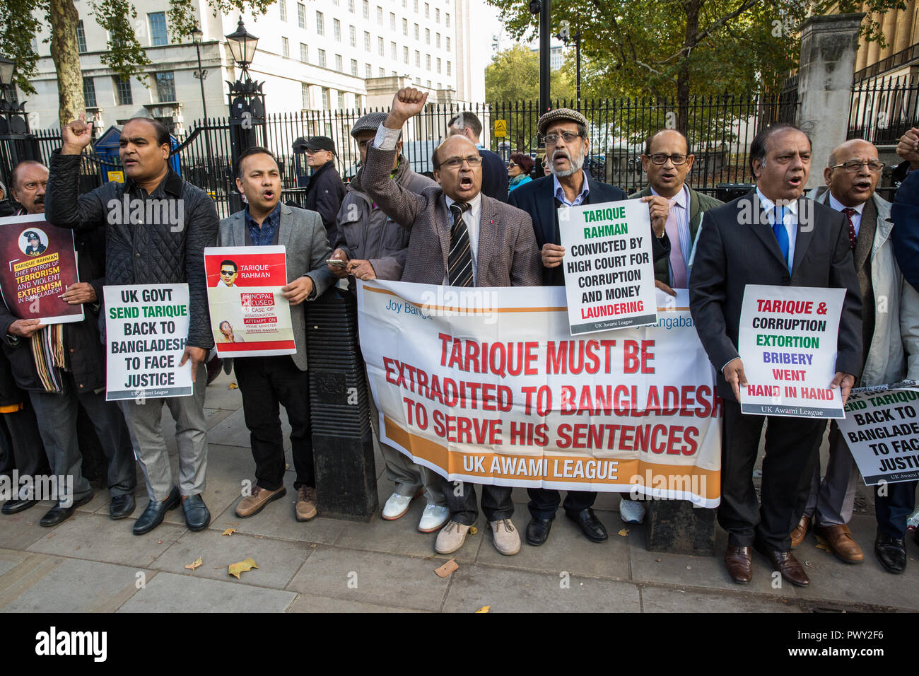 London, UK. 18th October, 2018. Campaigners from the UK Awami League, supporters of the current Government of Bangladesh under Prime Minister Sheikh Hasina, protest in Whitehall opposite Downing Street to call on the British Government to extradite Tarique Rahman, acting chairman of Bangladesh Nationalist Party, to Bangladesh. Tarique Rahman successfully applied for political asylum in the UK in 2008 and has since been granted indefinite leave to remain. Credit: Mark Kerrison/Alamy Live News Stock Photo