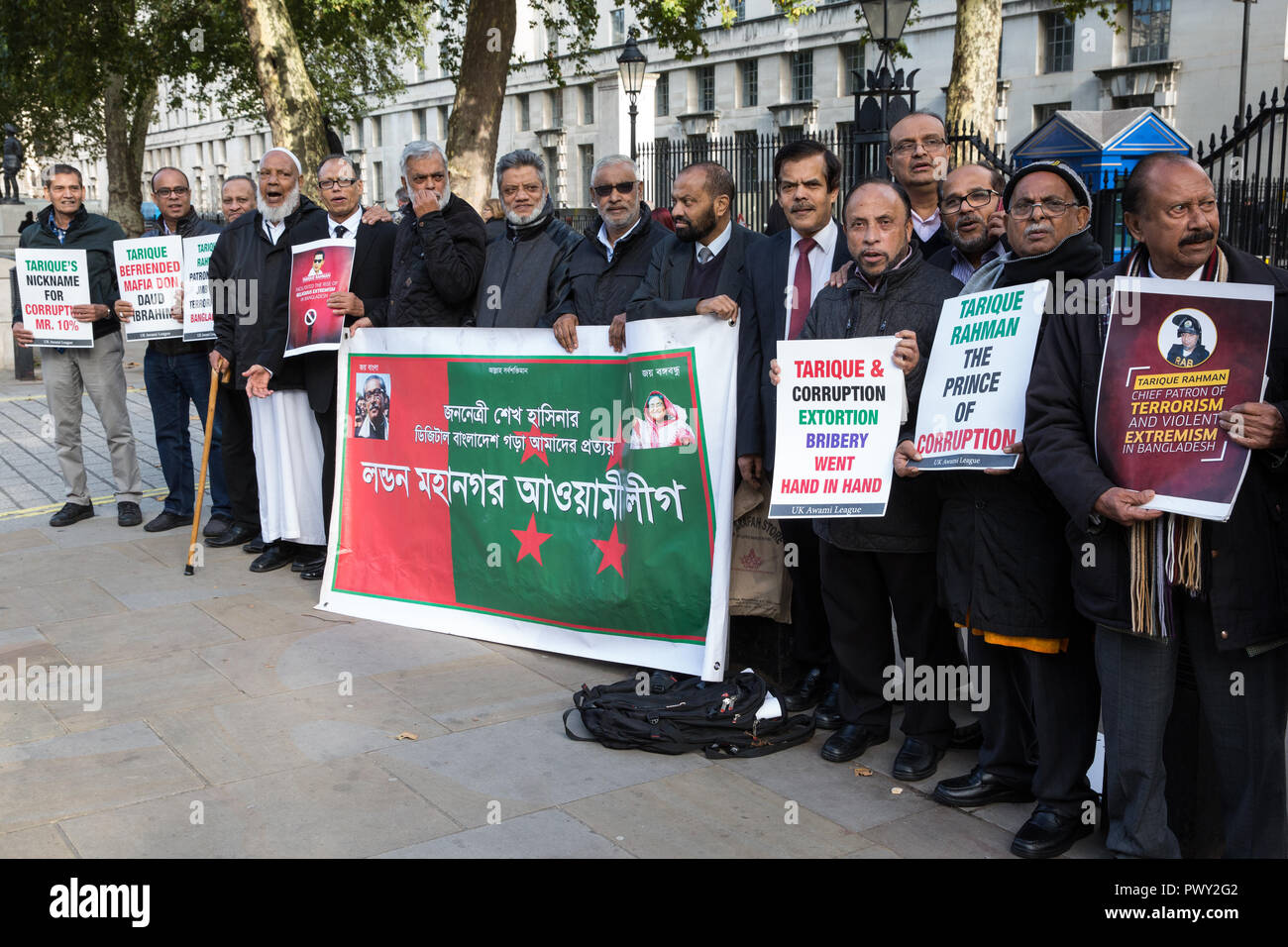 London, UK. 18th October, 2018. Campaigners from the UK Awami League, supporters of the current Government of Bangladesh under Prime Minister Sheikh Hasina, protest in Whitehall opposite Downing Street to call on the British Government to extradite Tarique Rahman, acting chairman of Bangladesh Nationalist Party, to Bangladesh. Tarique Rahman successfully applied for political asylum in the UK in 2008 and has since been granted indefinite leave to remain. Credit: Mark Kerrison/Alamy Live News Stock Photo