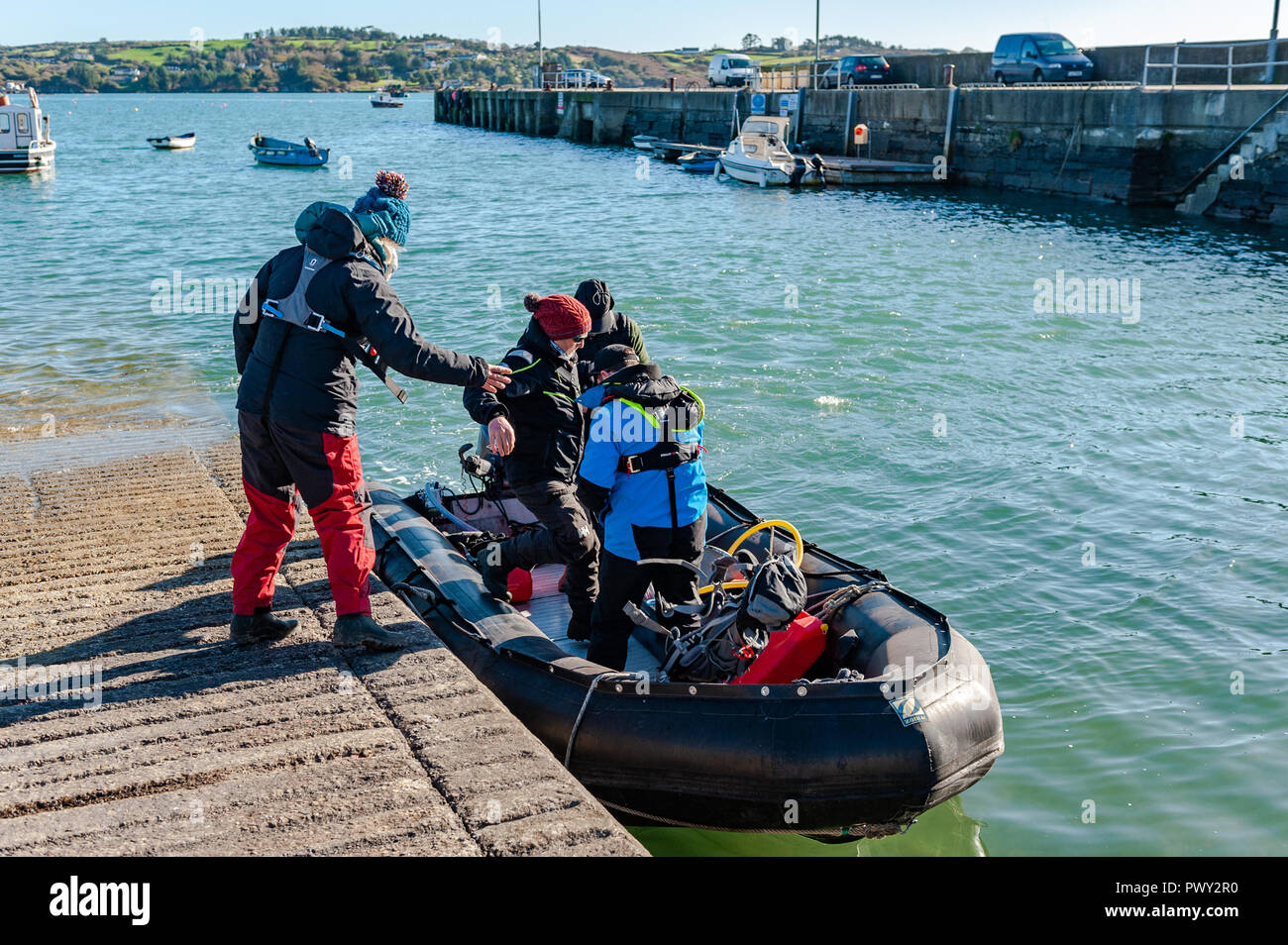 Schull, West Cork, Ireland. 18th Oct, 2018. Members of the National Parks and Wildlife Service board their RIB to spend a day counting seals and their pups around the islands near Schull as part of the Irish Government's conservation policy. The day will be dry and bright with sunny spells and temperatures of 11 to 14°C. Credit: Andy Gibson/Alamy Live News. Stock Photo