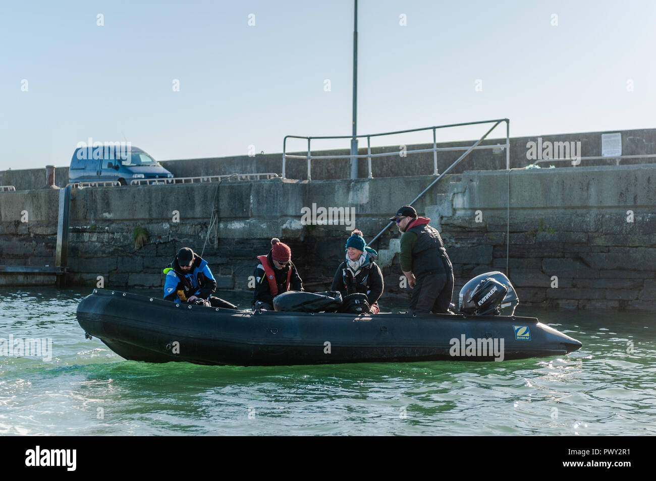 Schull, West Cork, Ireland. 18th Oct, 2018. Members of the National Parks and Wildlife Service aboard their RIB to spend a day counting seals and their pups around the islands near Schull as part of the Irish Government's conservation policy. The day will be dry and bright with sunny spells and temperatures of 11 to 14°C. Credit: Andy Gibson/Alamy Live News. Stock Photo