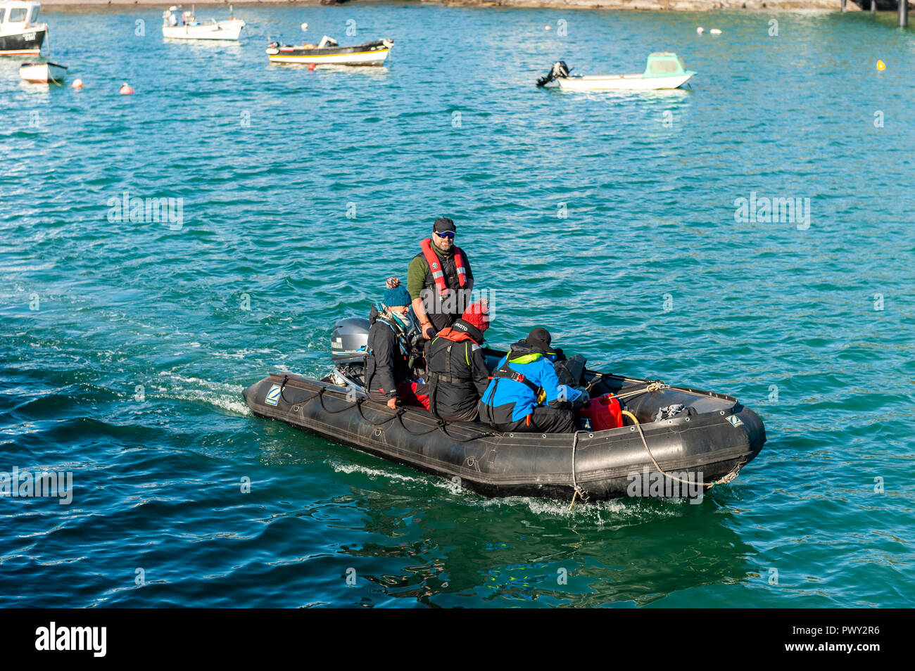Schull, West Cork, Ireland. 18th Oct, 2018. Members of the National Parks and Wildlife Service board their RIB to spend a day counting seals and their pups around the islands near Schull as part of the Irish Government's conservation policy. The day will be dry and bright with sunny spells and temperatures of 11 to 14°C. Credit: Andy Gibson/Alamy Live News. Stock Photo