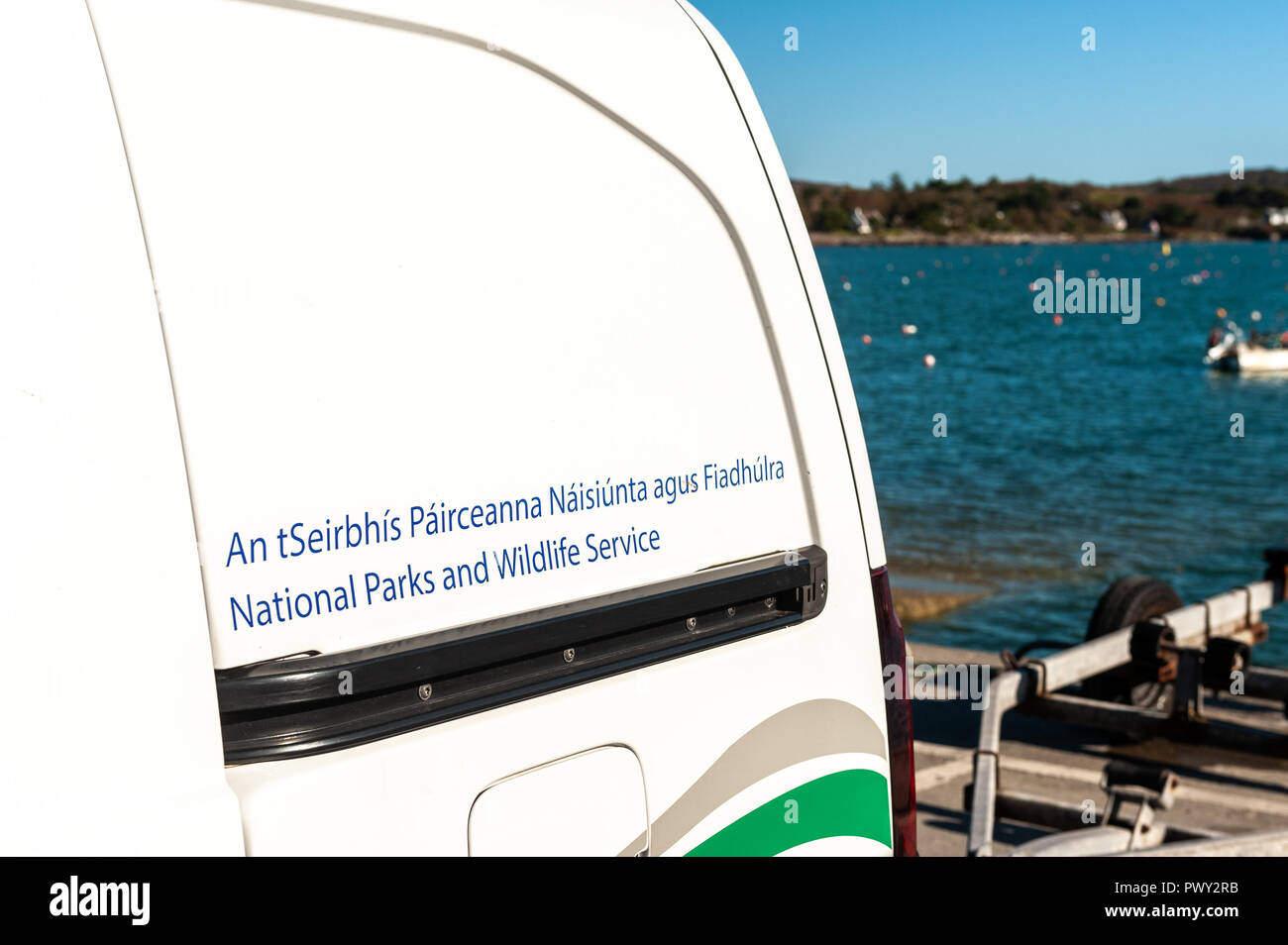 Schull, West Cork, Ireland. 18th Oct, 2018. A National Parks and Wildlife Service van sits on the quay after launching the RIB on which the Wildlife Service personnel will spend the day counting seals and their pups around the islands near Schull as part of the Irish Government's conservation policy. The day will be dry and bright with sunny spells and temperatures of 11 to 14°C. Credit: Andy Gibson/Alamy Live News. Stock Photo
