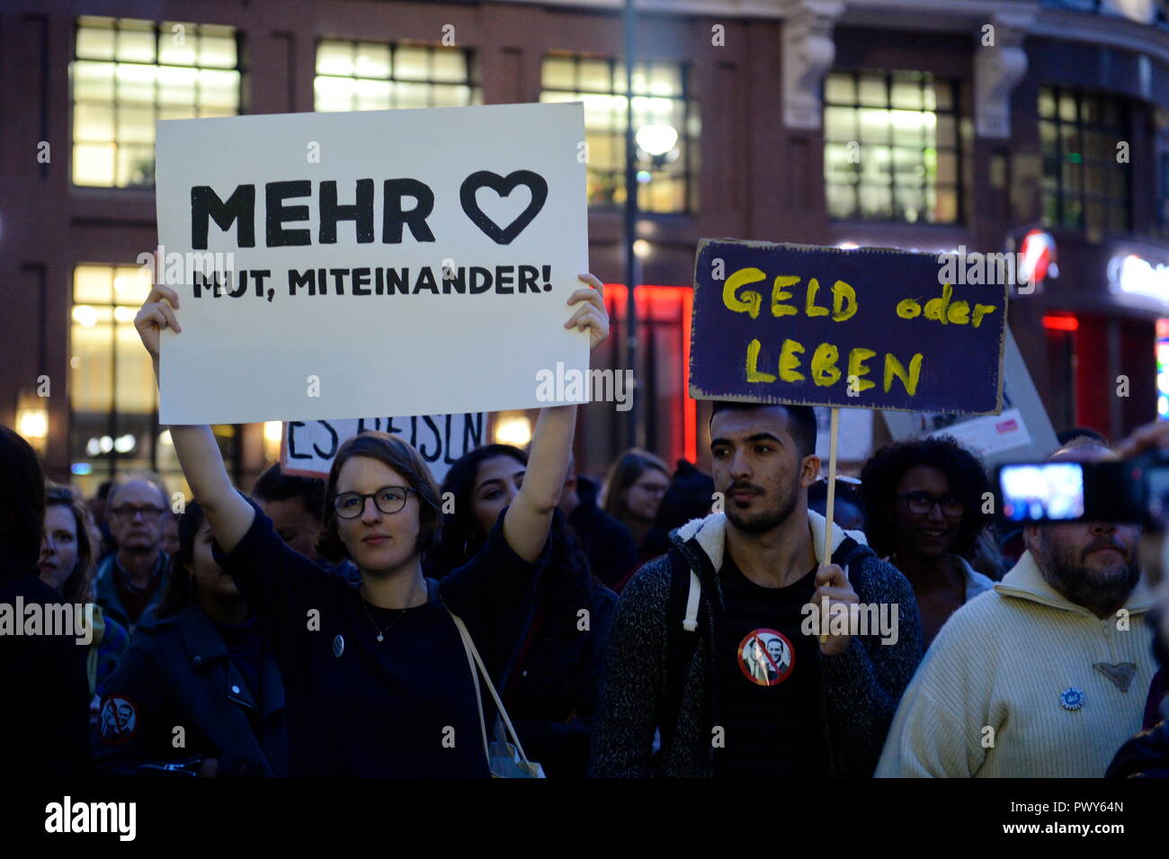 Vienna, Austria. 18 October 2018. The Thursday demonstrations against the current Federal Government are reactivated. The rally was called on Stephansplatz. The protests will then be continued every week at various locations in Vienna. Picture shows signs saying 'More courage with each other and money or life'. Credit: Franz Perc / Alamy Live News Stock Photo
