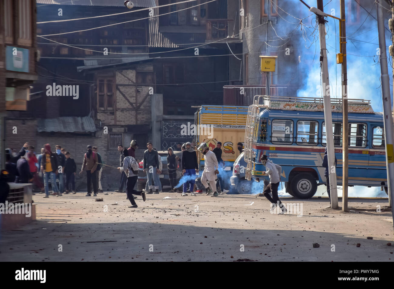 October 17, 2018 - Srinagar, Jammu & Kashmir, India - Kashmiri Protesters are seen reacting towards used tear gas smoke canisters during clashes. Credit: Idrees Abbas/SOPA Images/ZUMA Wire/Alamy Live News Stock Photo