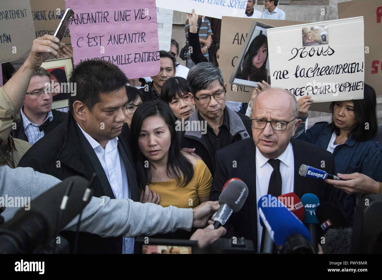 Strasbourg, France. 18th Oct, 2018. (From L) Laurent Te, a cousin, a mother and father Tan Tri Le Tan of Sophie Le Tan, flanked by lawyer Gerard Welzer seen speaking to the media after a meeting with the judge in the case of the disappearance of Sophie Le Tan outside the courthouse. Credit: Elyxandro Cegarra/SOPA Images/ZUMA Wire/Alamy Live News Stock Photo