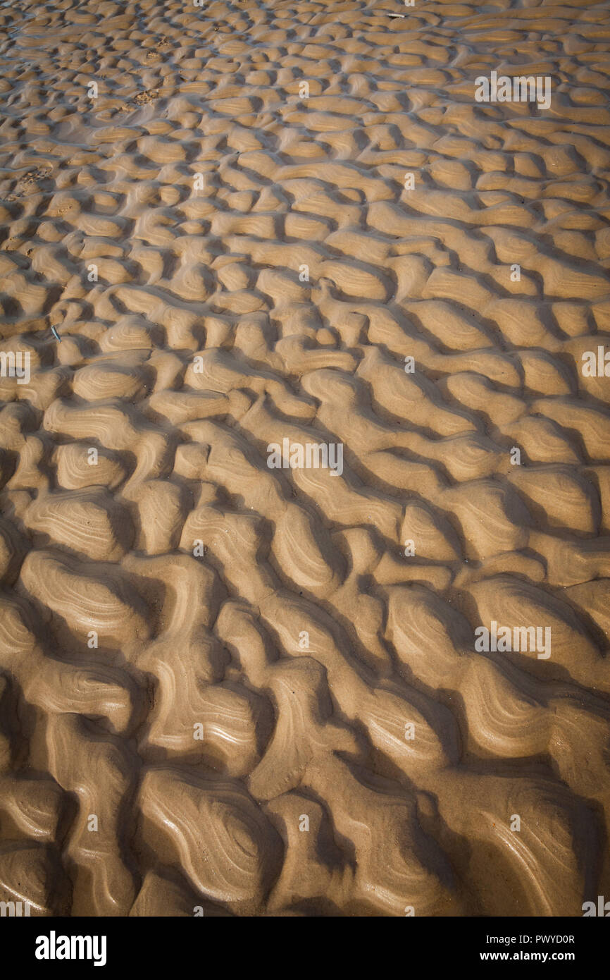 Ripples on a beach left by the retreating tide Stock Photo
