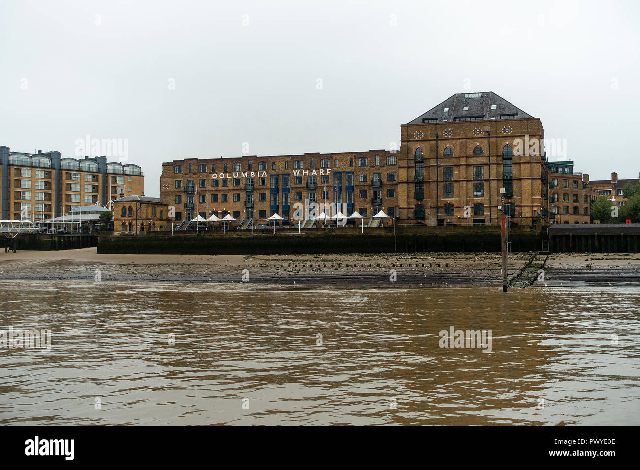 The Former Columbia Wharf Warehouse and Silo Building, now Housing and a Hotel on River Thames Rotherhide Southwark London England United Kingdom UK Stock Photo