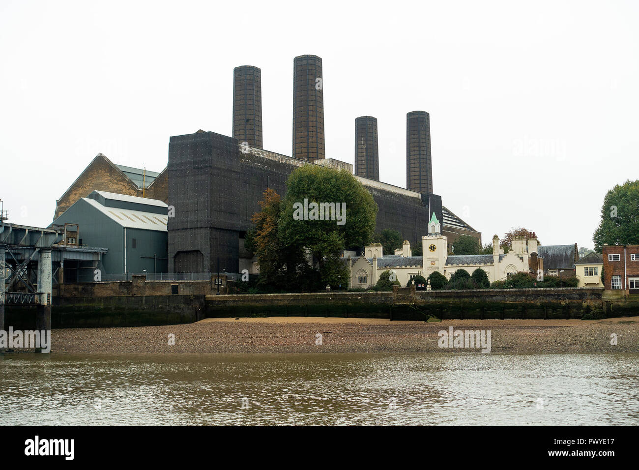 Greenwich Power Station and Trinity Hospital by River Thames Old Woolwich Road Greenwich London England United Kingdom UK Stock Photo