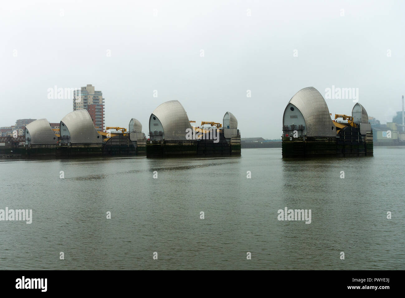 The Thames Barrier Flood Defences in the River Thames near Greenwich and Silvertown Greater London England United Kingdom Stock Photo
