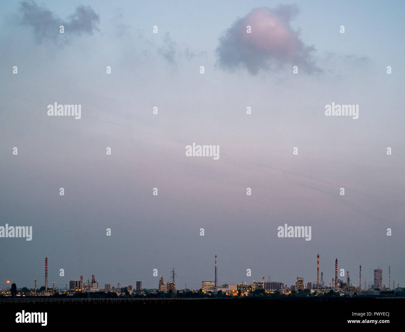 Industrial plants at the dusk, Ferrara, Emilia Romagna, Italy. Stock Photo