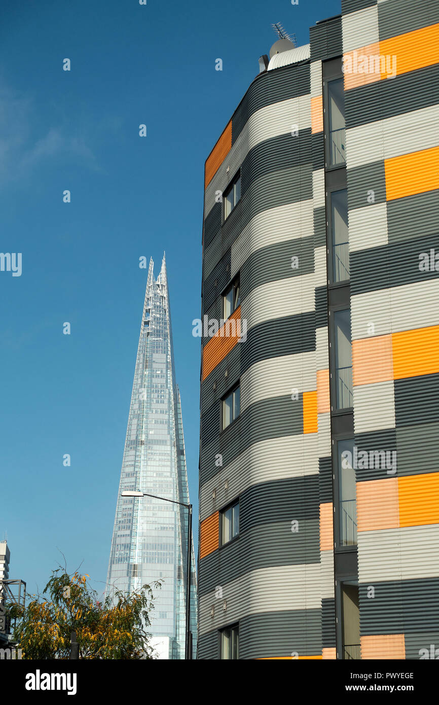 The Shard Glass Skyscraper Building with a Colourful Apartment Block in the Foreground in Southwark London England United Kingdom UK Stock Photo