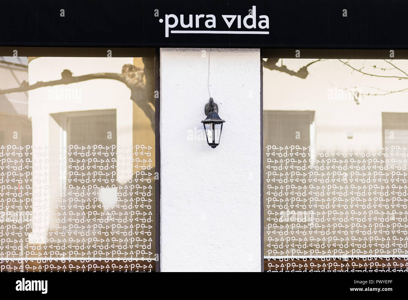 Windows exterior of the Italian restaurant and cocktail bar in the seaside town of Sitges, Catalonia Stock Photo