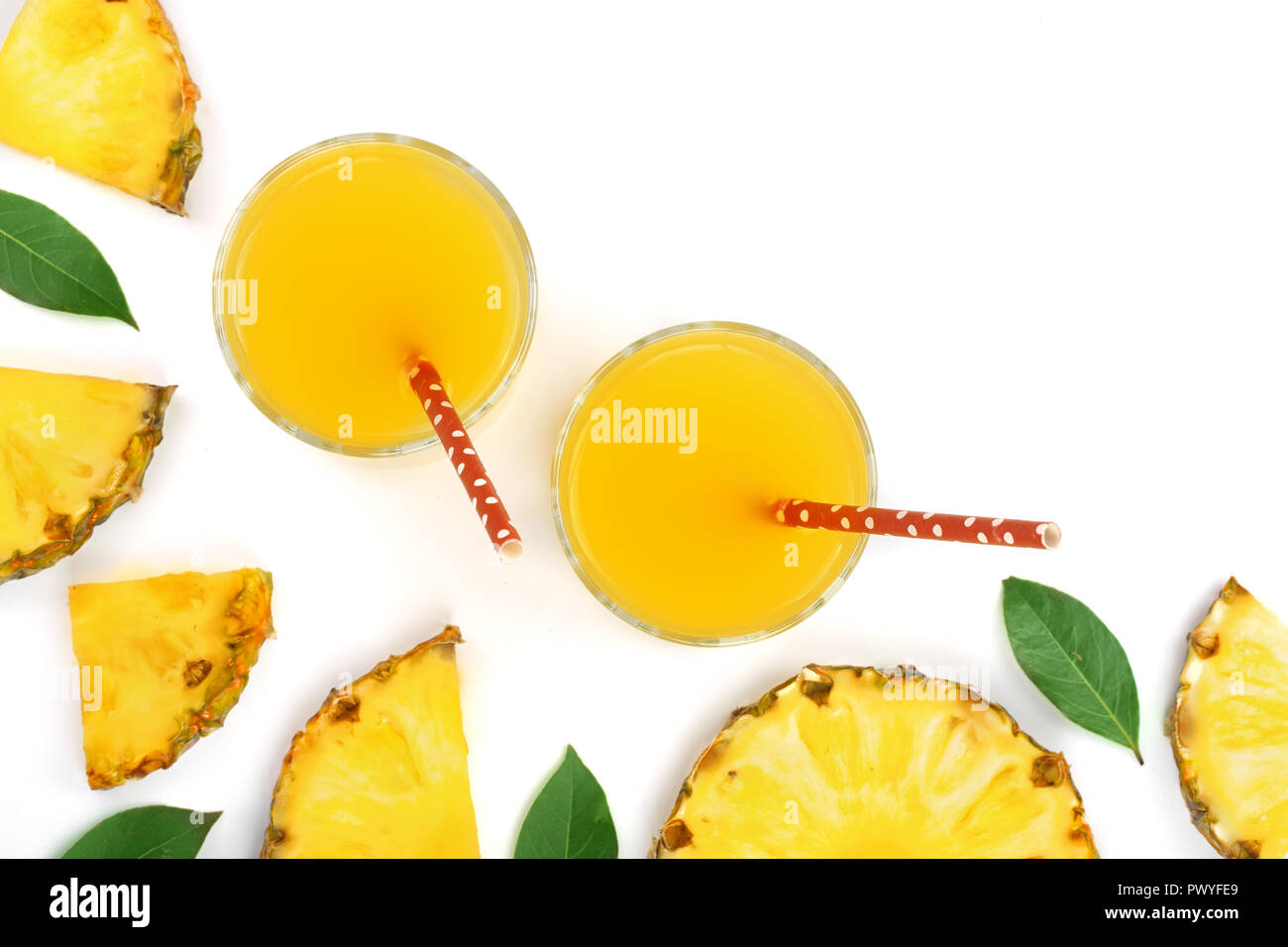 pineapple juice in a glass and pineapple slices isolated on white ...
