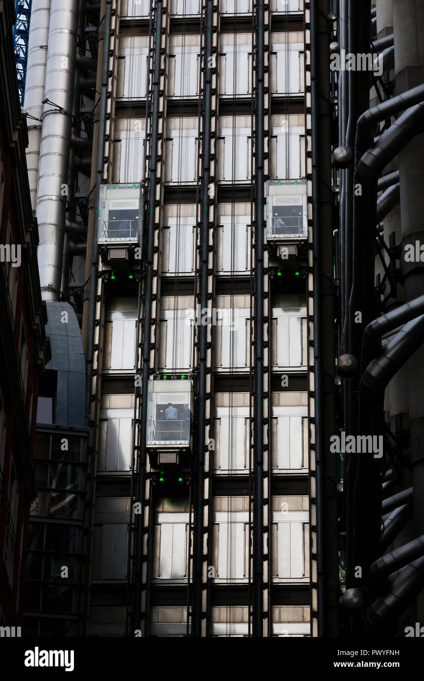 London, UK. External lifts are seen moving up and down on the Lloyd's Building in the City of London. Stock Photo
