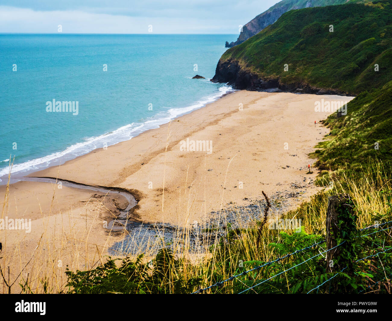 View from the coastal path over Traeth beach towards Penbryn on the Welsh coast in Ceredigion. Stock Photo