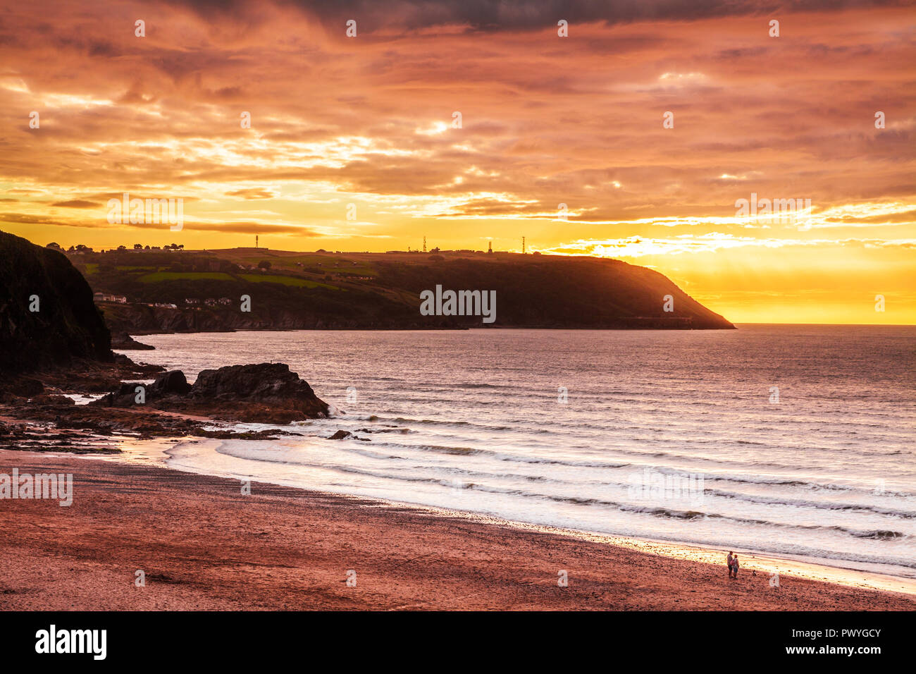 Sunset over the beach at Tresaith in Ceredigion, Wales, looking towards Aberporth. Stock Photo