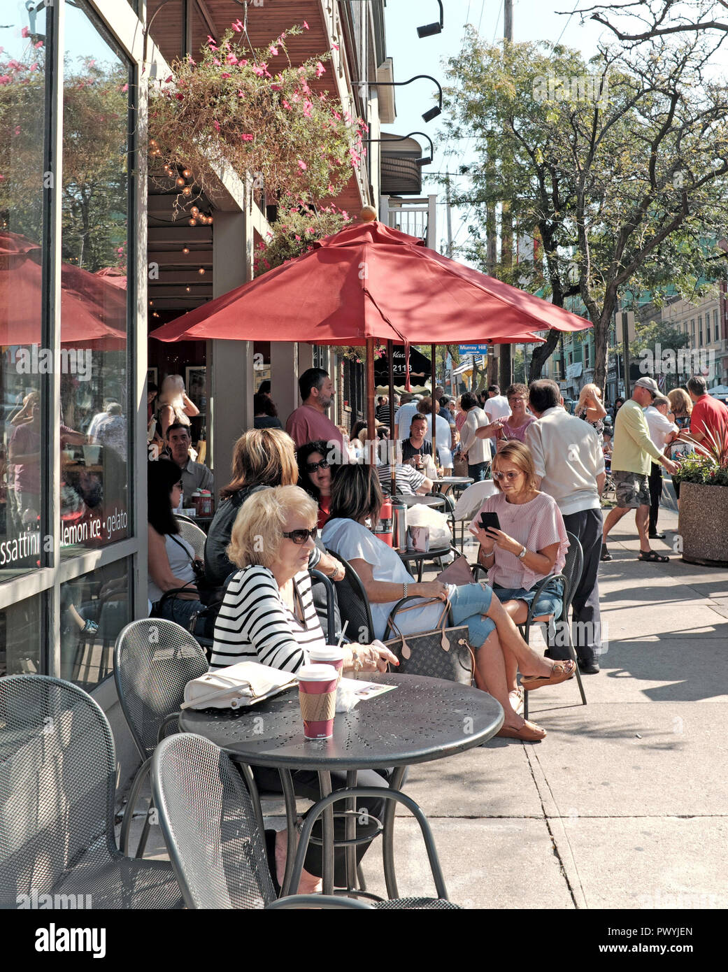 Busy outdoor cafe seating in front of Prestis Bakery in the Little Italy  neighborhood of Cleveland, Ohio, USA, opened in 1903 on Mayfield Road Stock  Photo - Alamy
