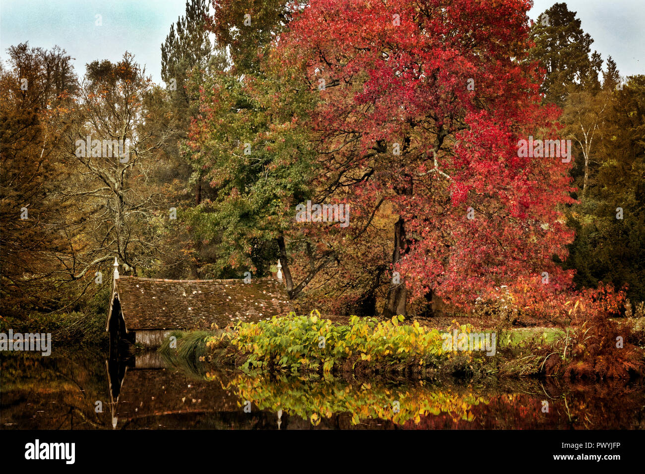 Boat house on a lake in Autumn Stock Photo