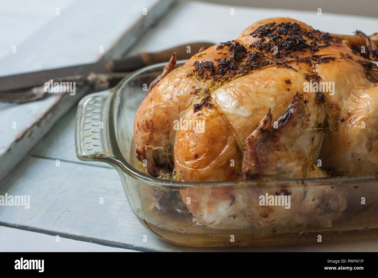 roasted chicken with garlic and butter on tray Stock Photo Alamy