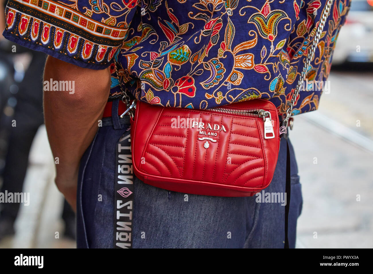 MILAN, ITALY - SEPTEMBER 21, 2018: Man with red leather Prada bag and  floral blue shirt before Iceberg fashion show, Milan Fashion Week street  style Stock Photo - Alamy