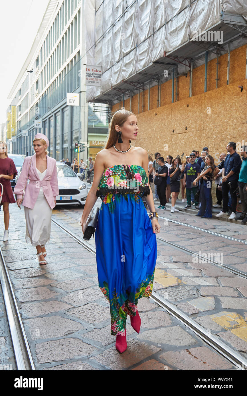 MILAN ITALY SEPTEMBER 21 2018 Woman with blue and floral dress before Iceberg fashion show Milan Fashion Week street style Stock Photo Alamy