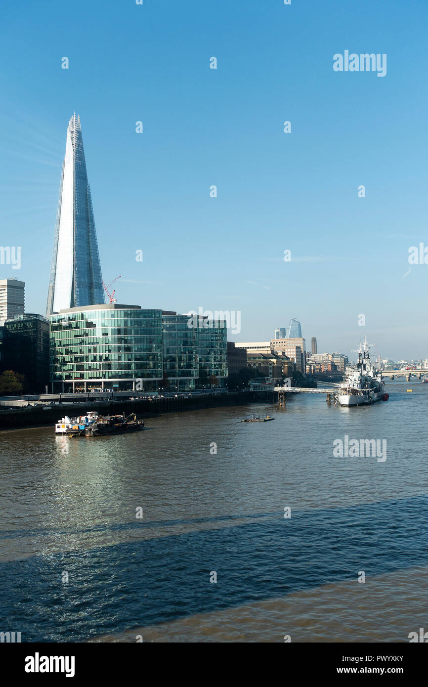 The Shard Skyscraper and HMS Belfast on the Southbank of the River Thames from Tower Bridge Tower Hamlets London United Kingdom UK Stock Photo