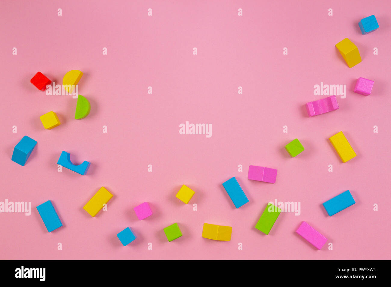 Colorful wooden building blocks on pink background Stock Photo Alamy