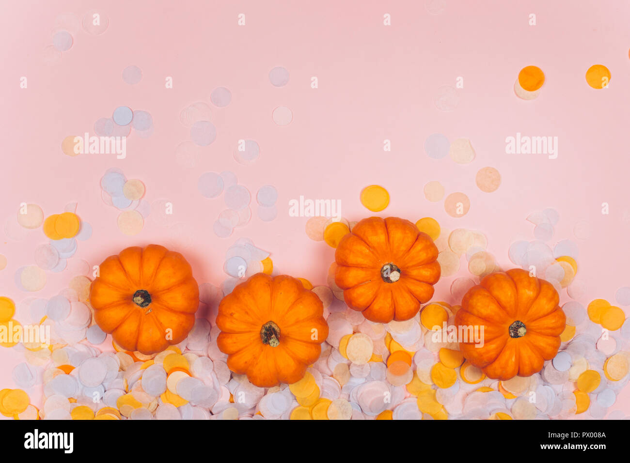 Little decorative pumpkins with confetti Stock Photo Alamy