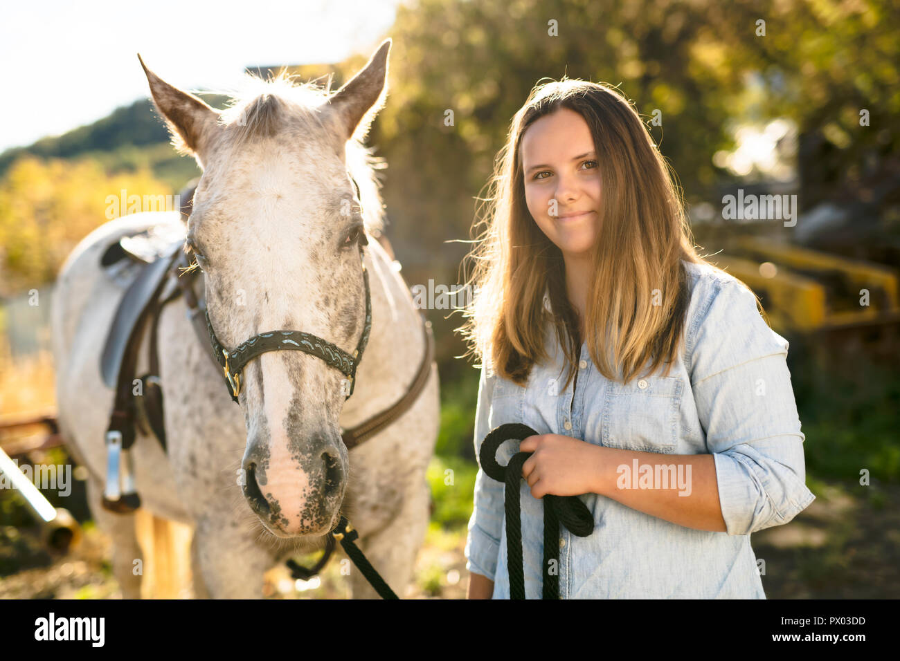 A Beautiful teen girl on the farm with her horse Stock Photo - Alamy