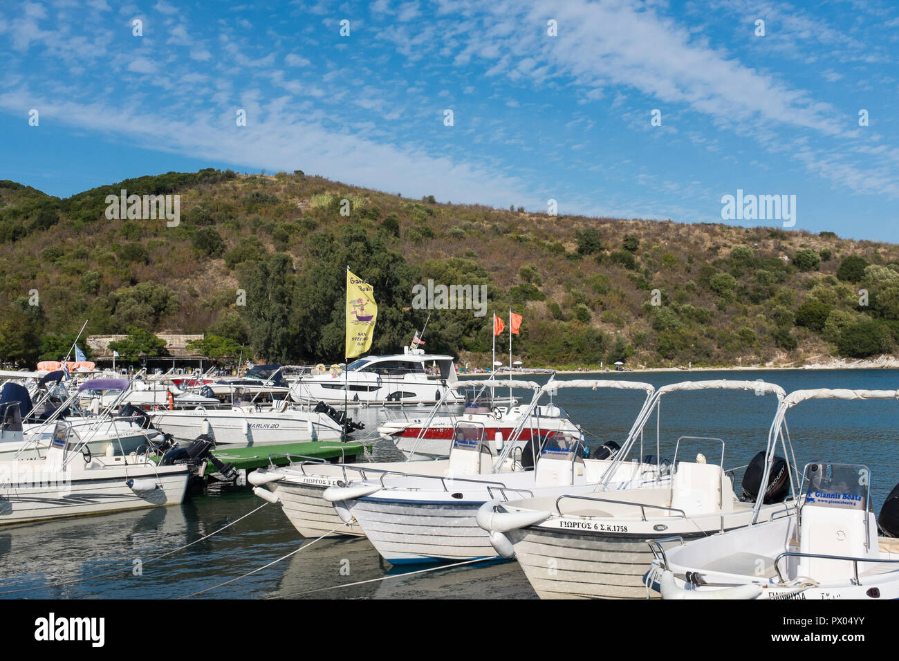 Pleasure motor boats moored at the harbour at Agios Stefanos in north east Corfu island Stock Photo