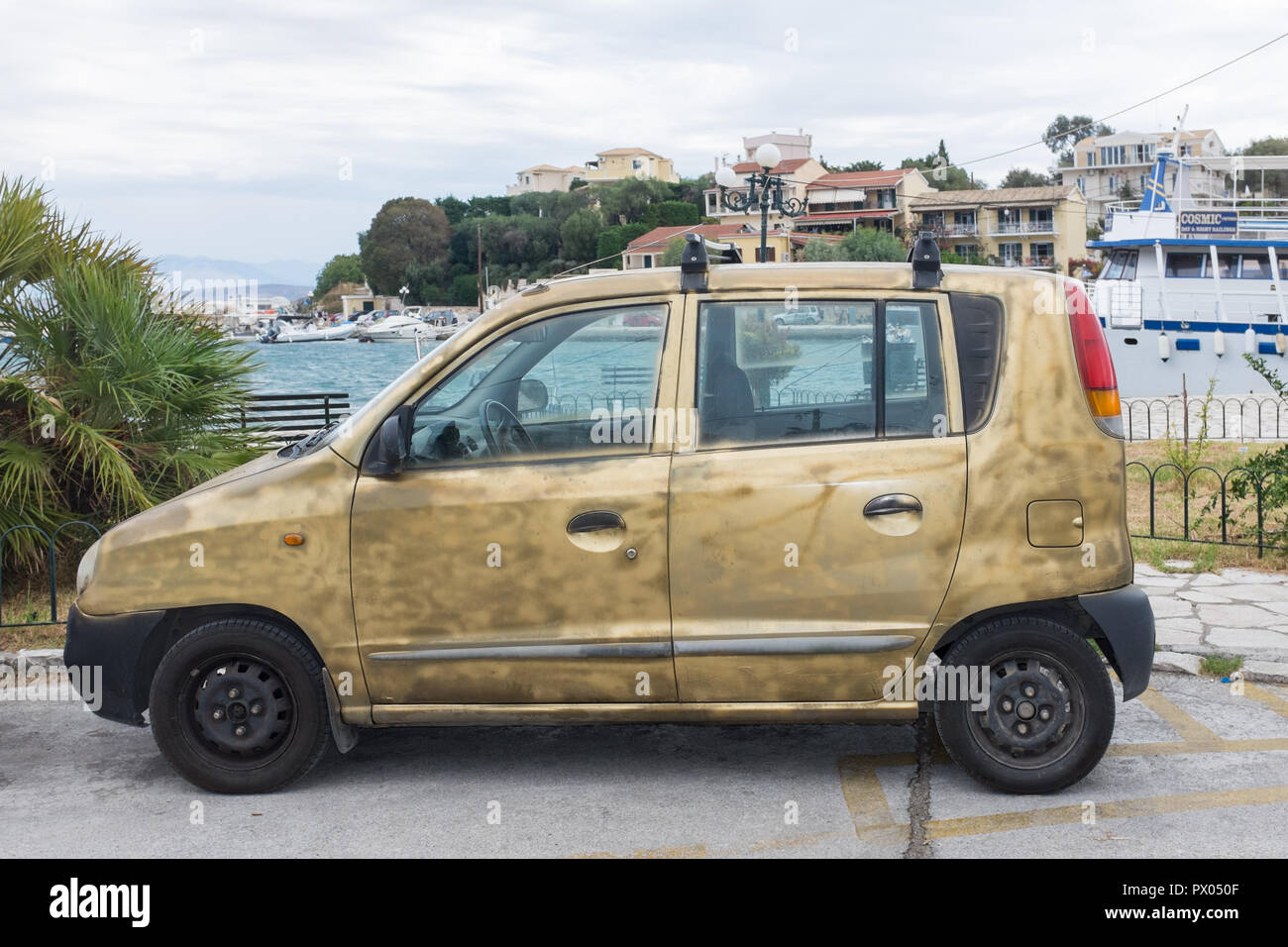 Shabby hatchback car painted made to look old and dirty Stock Photo