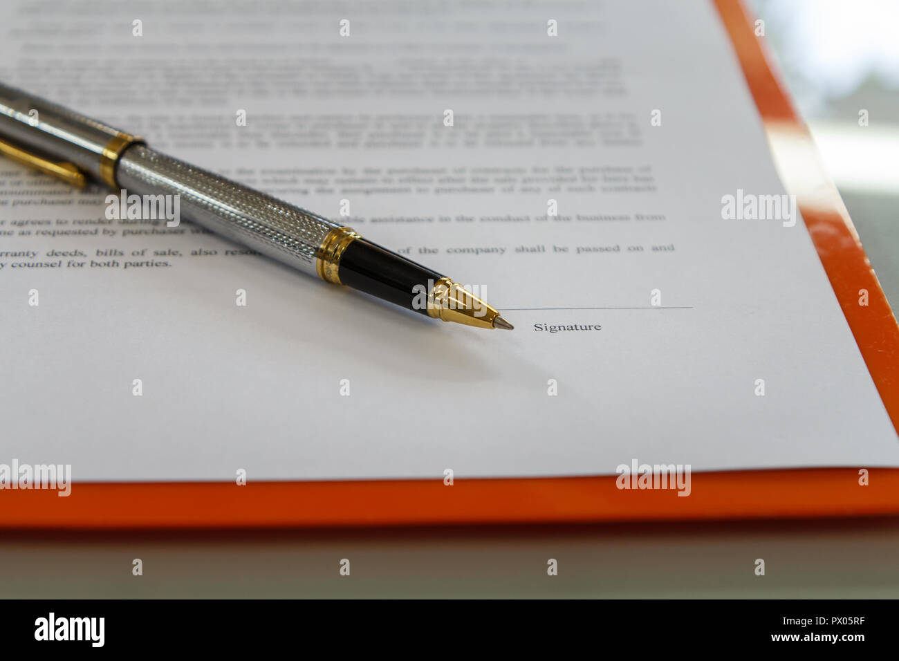 A pen on contract paper preparation for signing a contract. Stock Photo