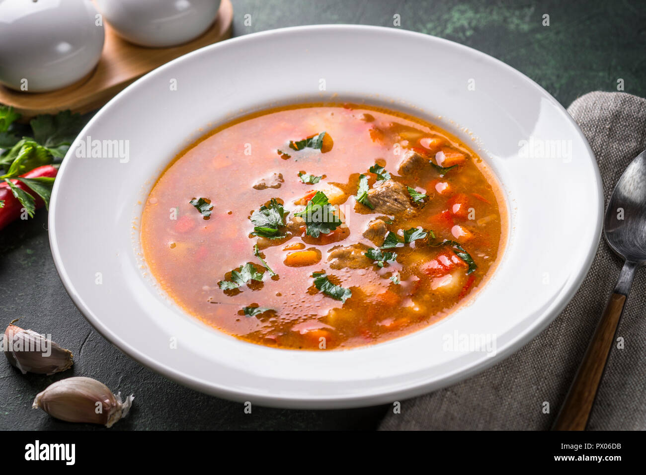 Traditional Hungarian goulash soup on the table. Stock Photo