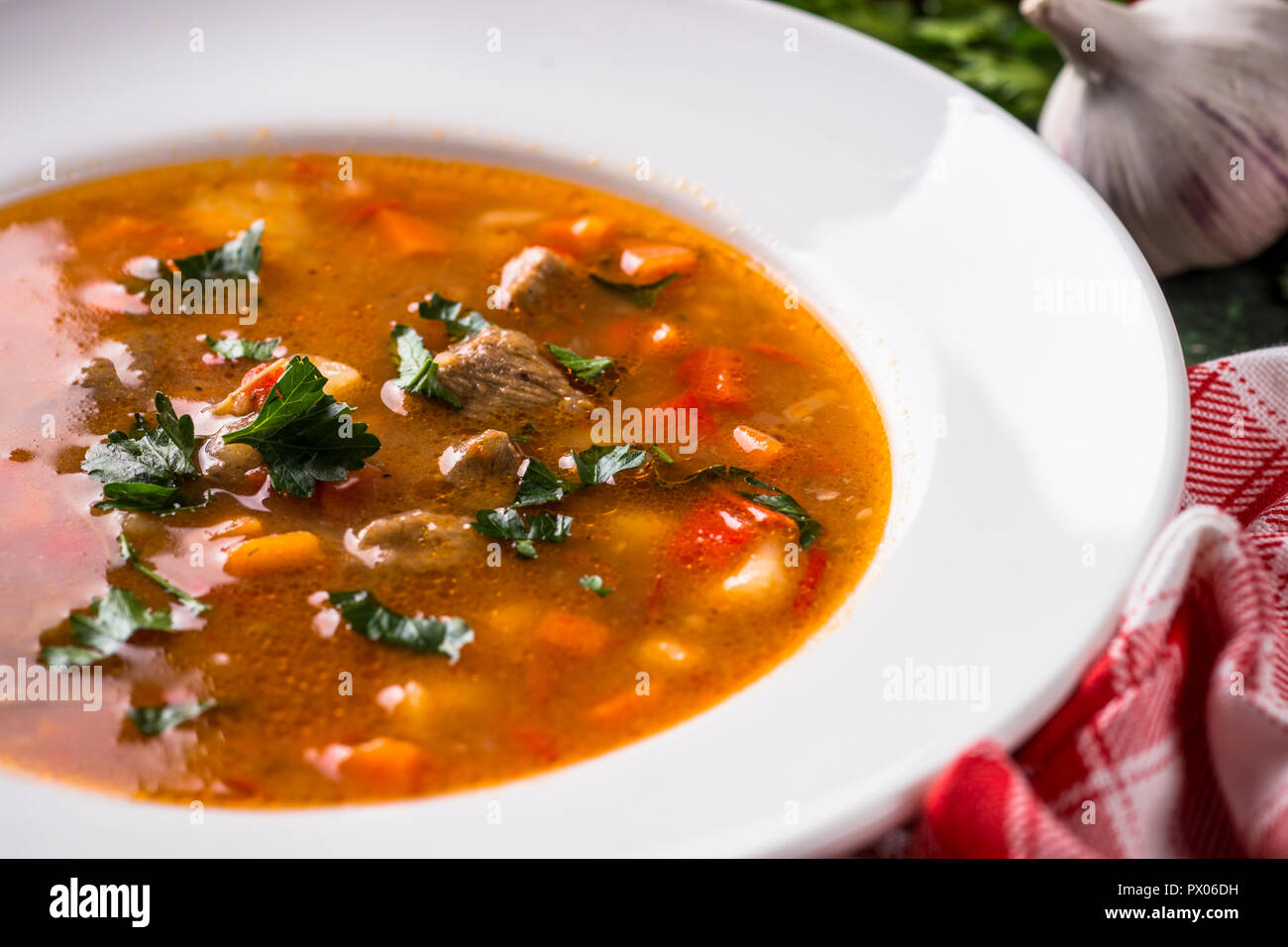 Traditional Hungarian goulash soup on the table. Stock Photo