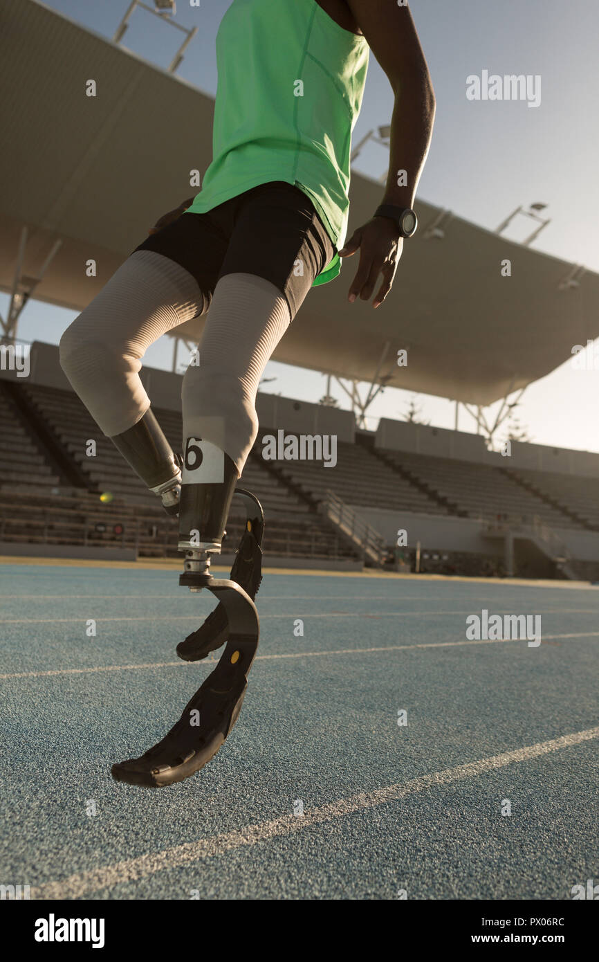 Disabled athletic running on a running track Stock Photo