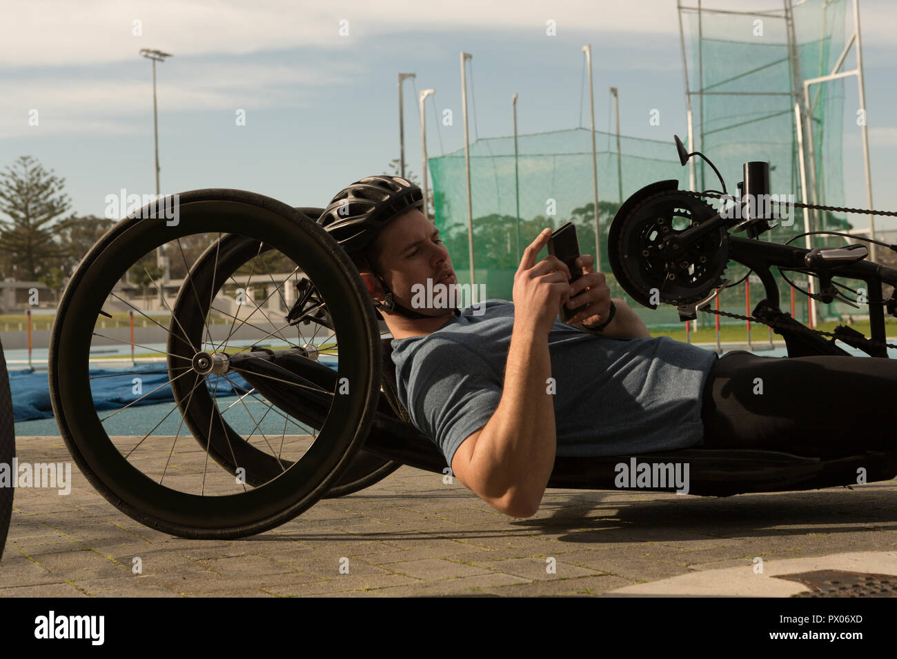 Disabled athlete using mobile phone in wheelchair Stock Photo Alamy
