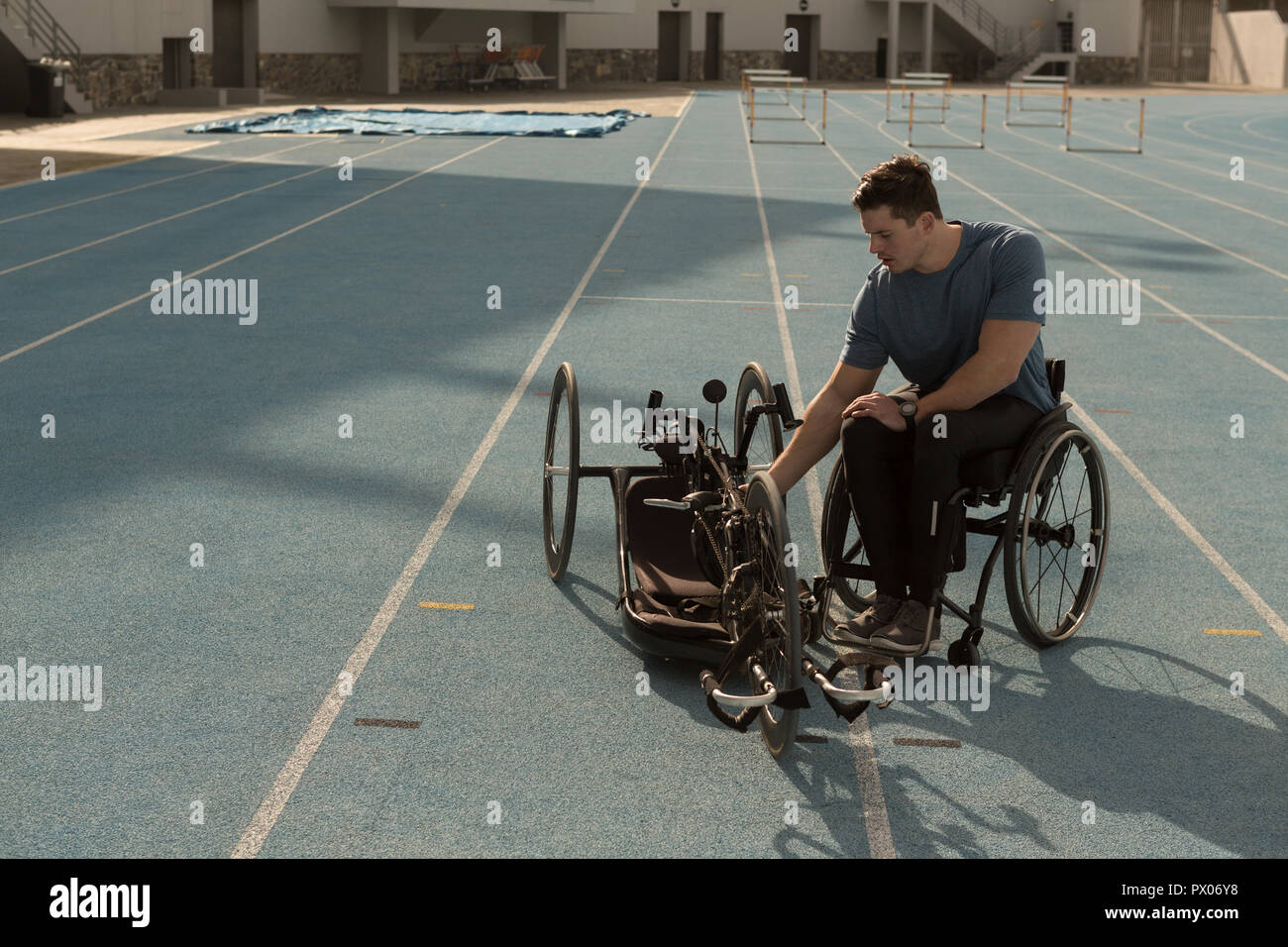 Disabled athletic with wheelchair on a racing track Stock Photo