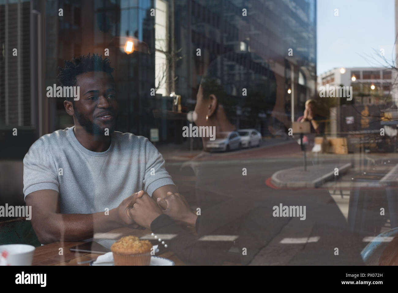 Couple interacting with each other in cafe Stock Photo