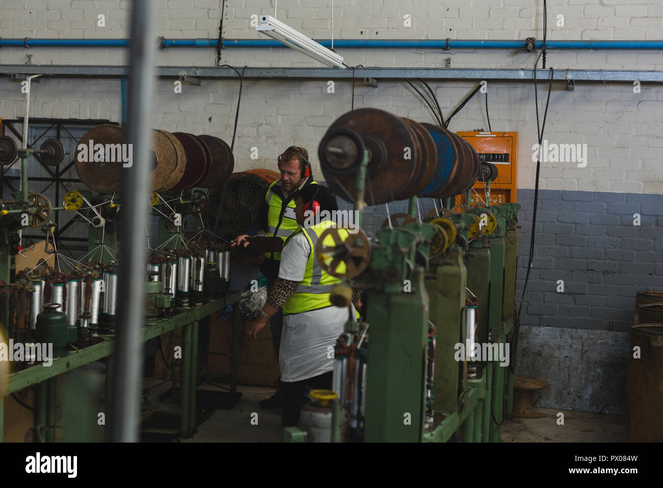 Man and woman making rope hi-res stock photography and images - Alamy
