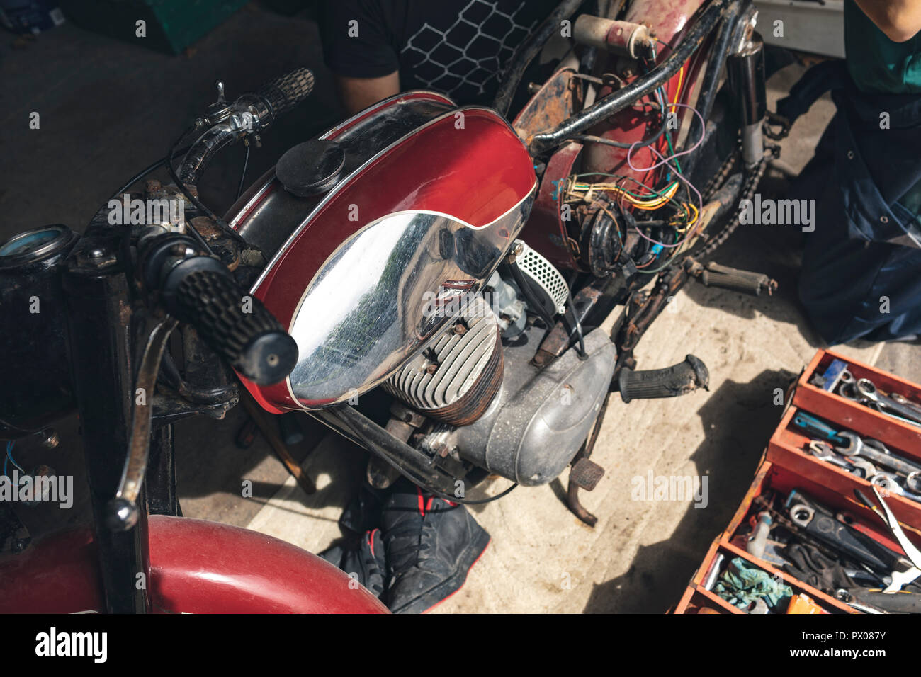 Motorbike in repair garage Stock Photo Alamy