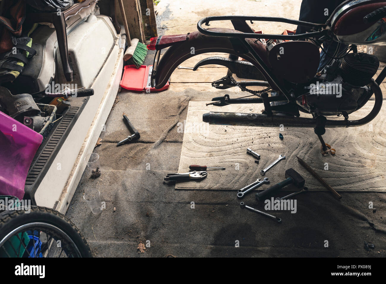 Motorbike in repair garage Stock Photo Alamy