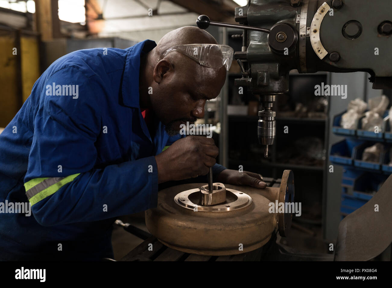 Blacksmith working in workshop Stock Photo
