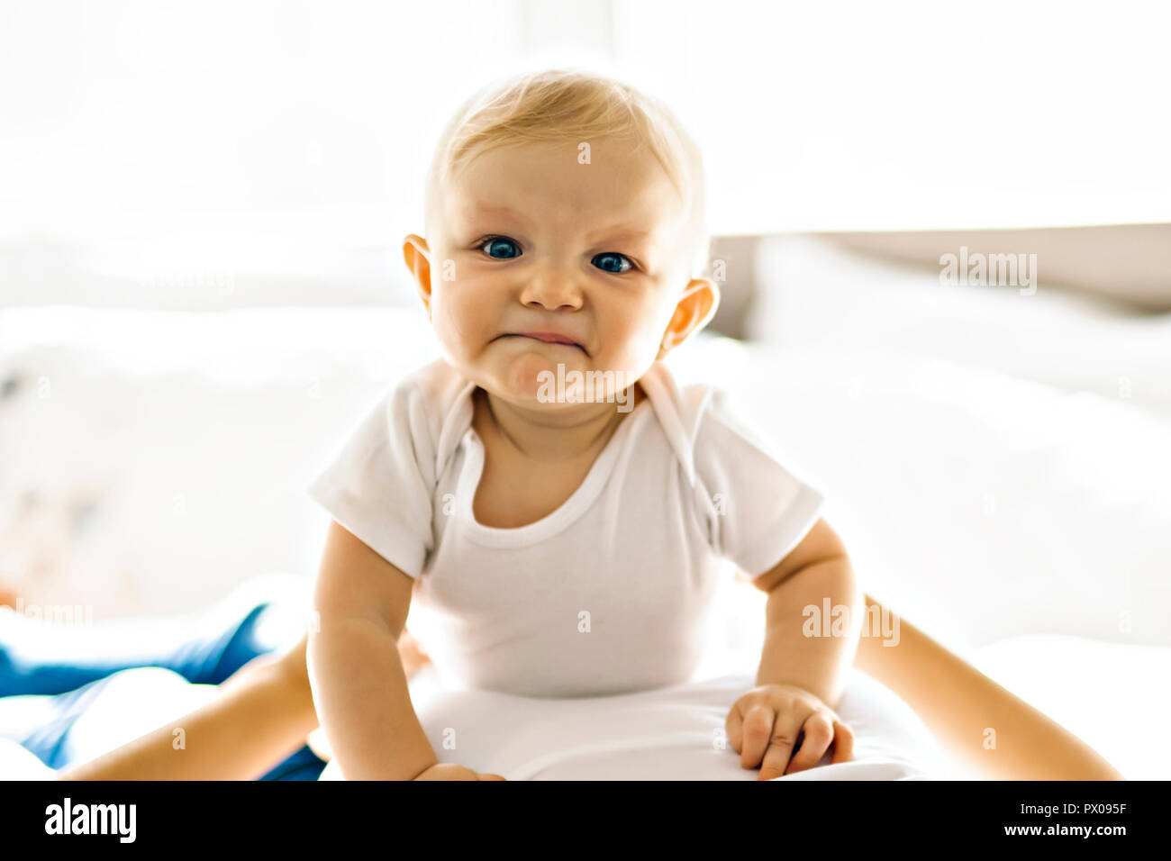 mother with baby on bed Stock Photo Alamy