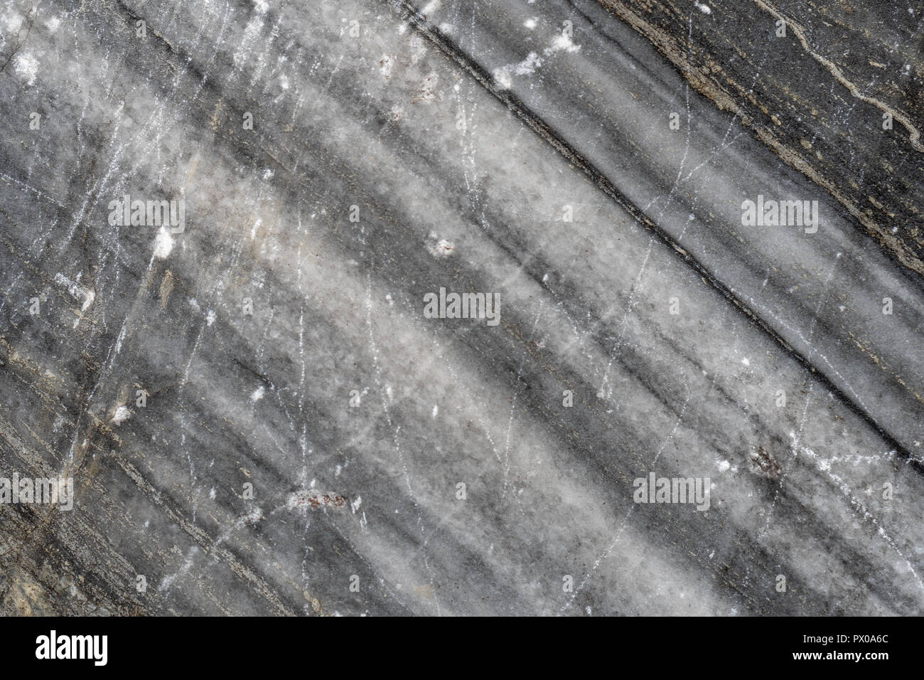 Gray surface of marble stone with striped streaks. Stock Photo