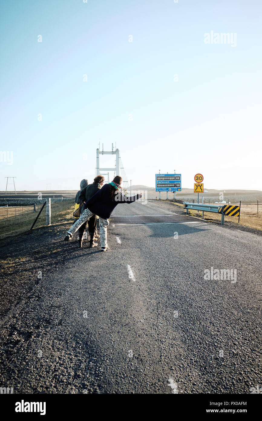 Hitchhikers waiting on the Iceland ring road route 1 in Iceland Stock Photo