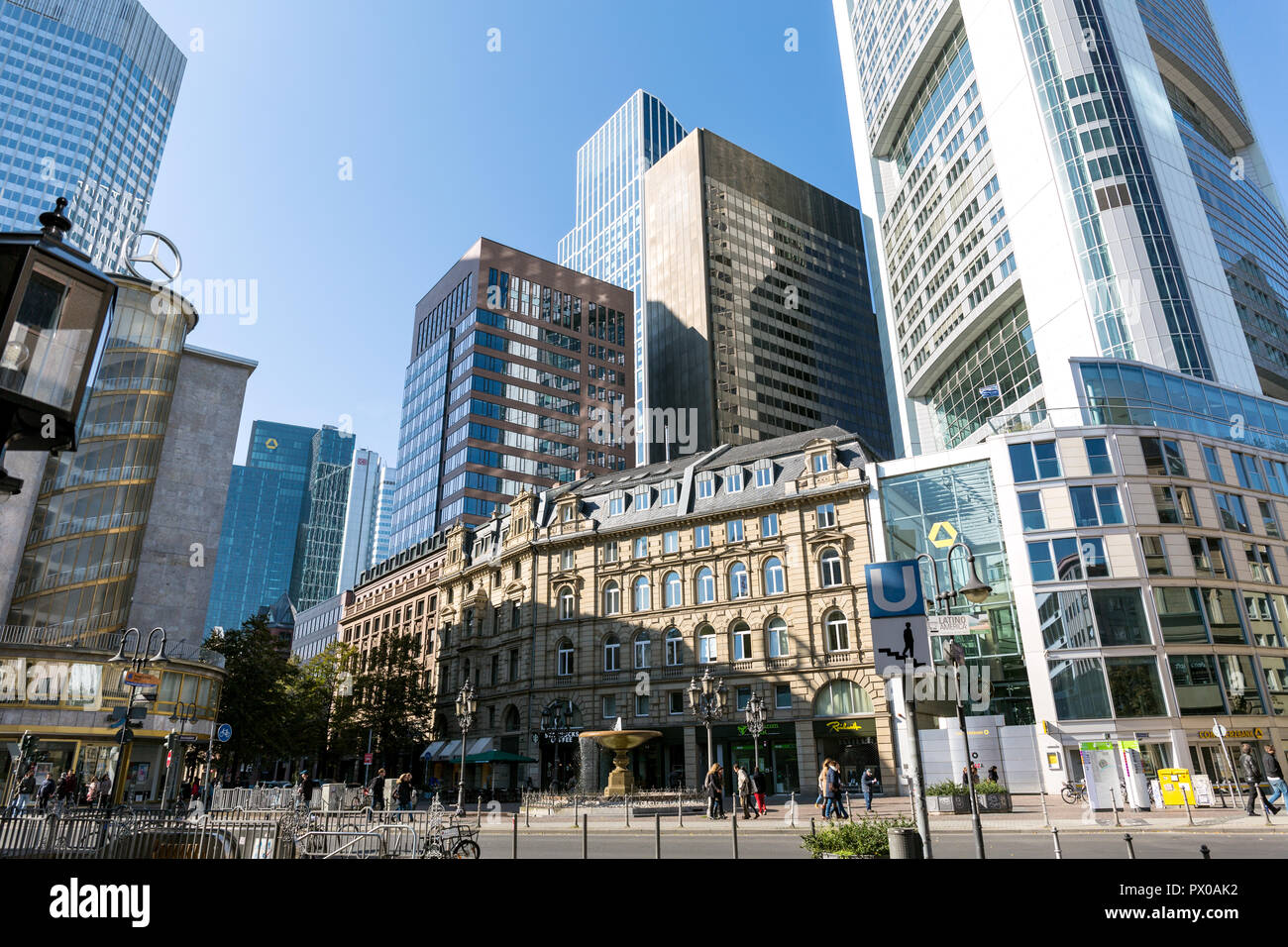 Frankfurt, Germany, October 11th. 2015 - An old building is surrounded by modern skycrapers, with converging lines crushing the ancient building. Stock Photo