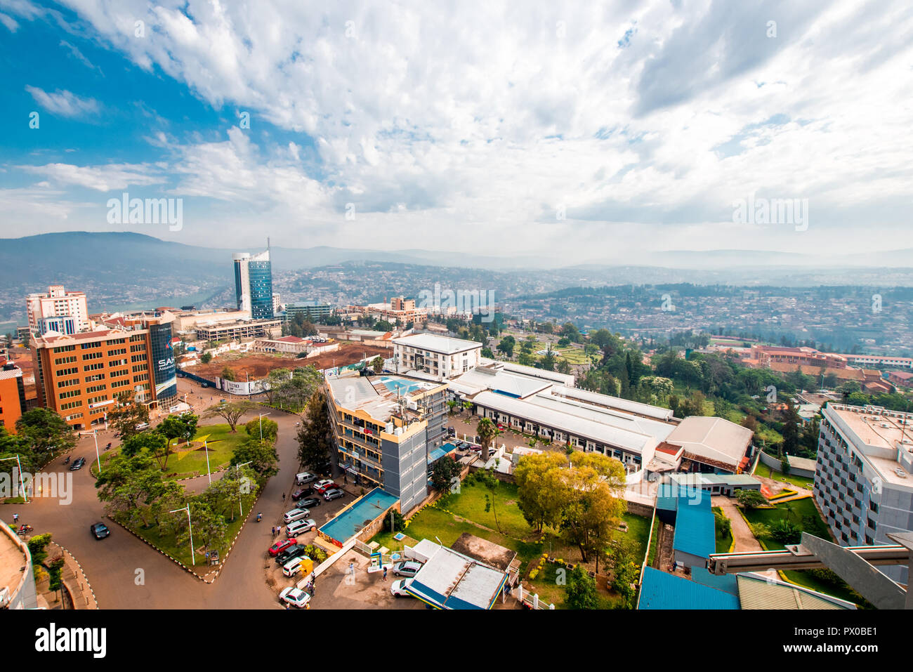 Kigali, Rwanda - September 21, 2018: a wide, sweeping panorama of the city centre with Kigali City Tower against the backdrop of distant blue hills Stock Photo