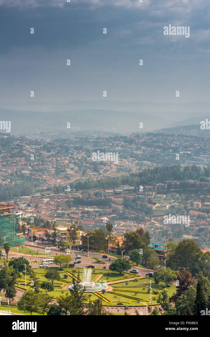 Kigali, Rwanda - September 21, 2018: A high angle view of the fountain roundabout near the city centre with rows of hills fading into the distance Stock Photo
