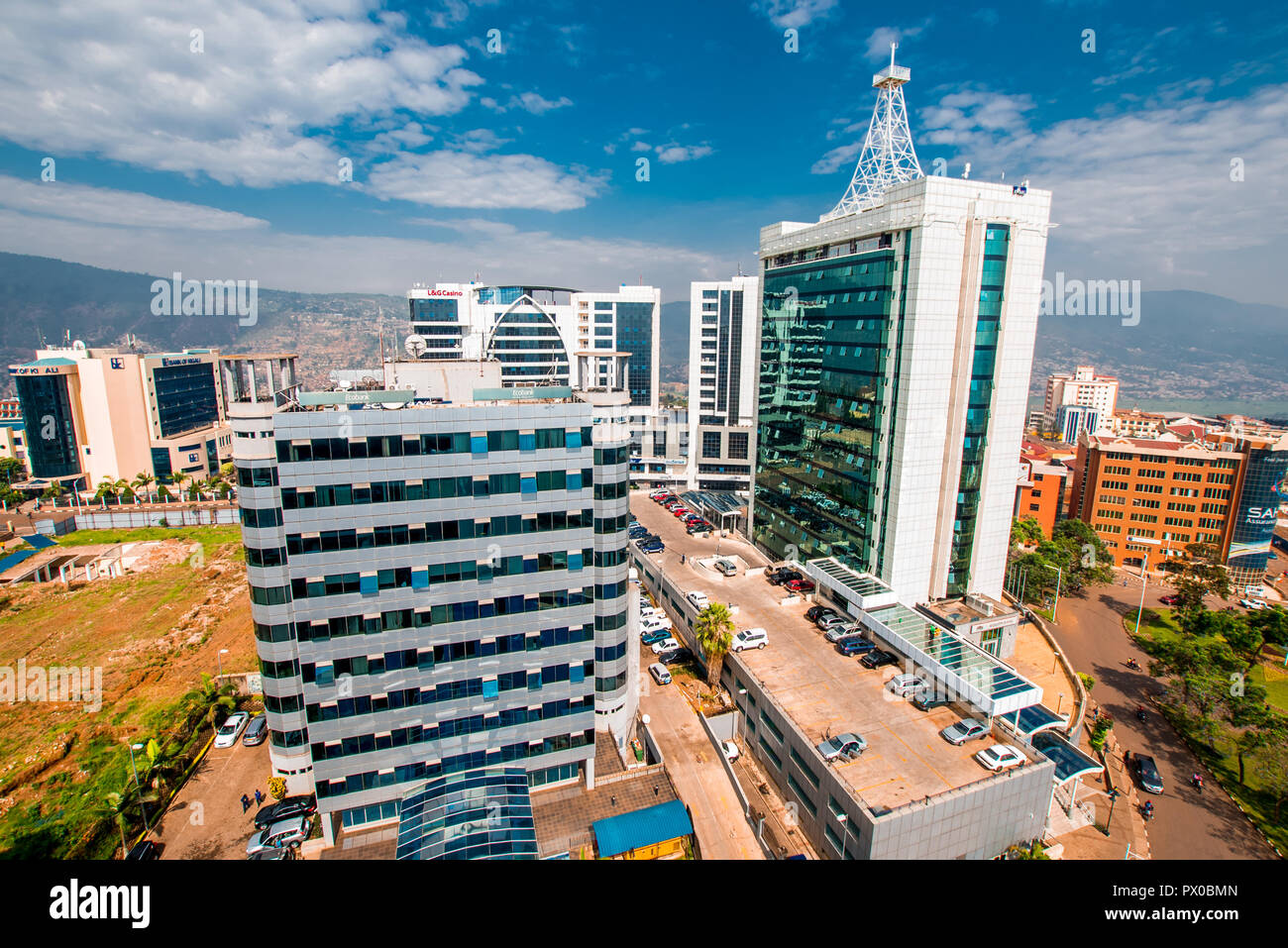 Kigali, Rwanda - September 21, 2018: a wide view looking down on the city centre with Ecobank and Pension Plaza looming in the foreground and Kigali C Stock Photo